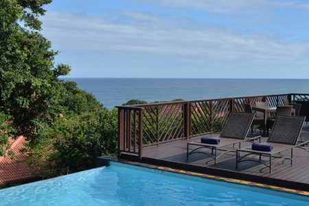 swimming pool with lounge chairs